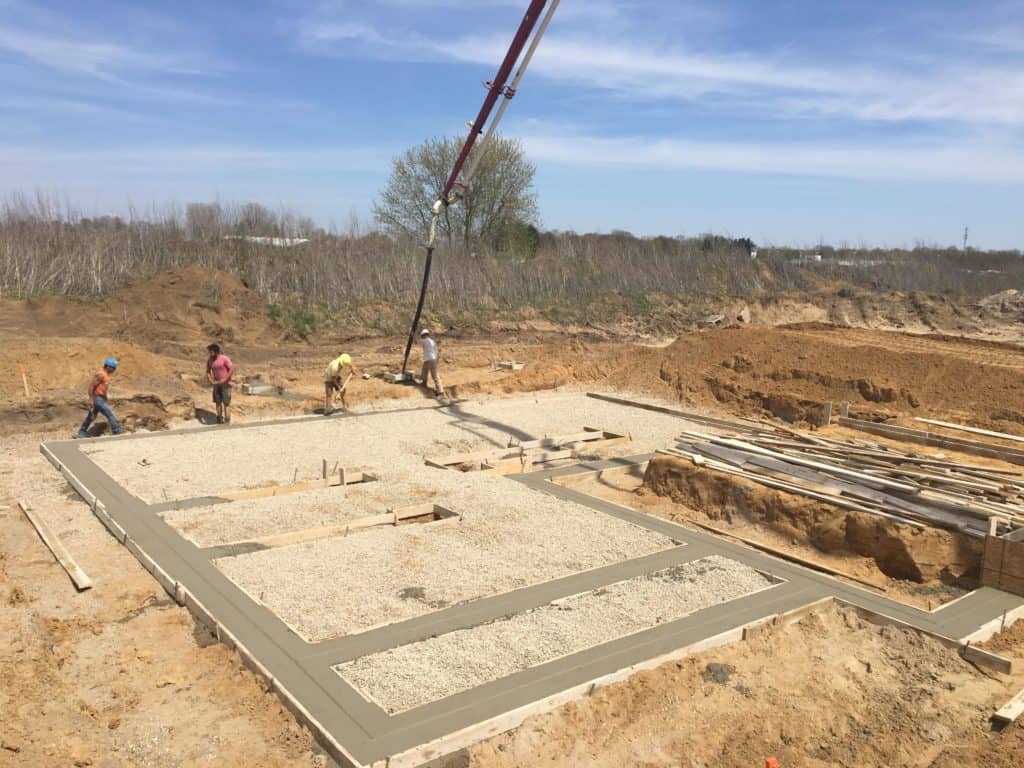Concrete Form Setters building house foundation